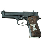 Beretta 92FS grips made of walnut wood with custom logos made of silver.6