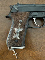 Beretta 92FS grips made of walnut wood with custom logos made of silver.3