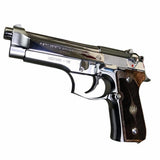 Beretta 92FS grips made of walnut wood with custom logos made of silver.1