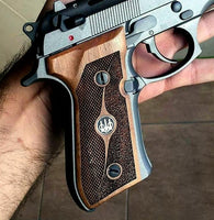 Beretta 92FS grips made of walnut wood with custom Logos made of silver.