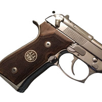 Beretta 92FS grips made of walnut wood with custom logos made of silver.