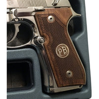 Beretta 92FS grips made of walnut wood with custom logos made of silver.left