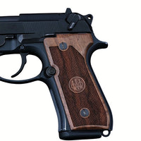 Beretta 92FS grips made of walnut wood with custom engraving.left