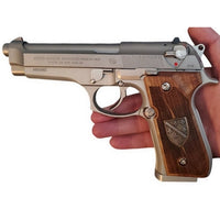 Beretta 92FS grips made of walnut wood with custom logos made of silver.2