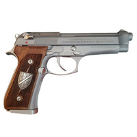 Beretta 92FS grips made of walnut wood with custom logos made of silver.6