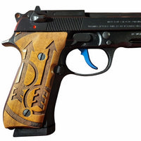 Beretta 92FS grips made of walnut wood with custom surface engraving.