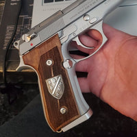 Beretta 92FS grips made of walnut wood with custom logos made of silver.right