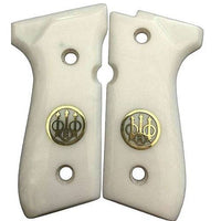 Beretta 92FS grips made of  ivory Acrylic  and custom logo made of brass.