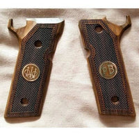 Beretta 92 Steel 1 custom pistol grips made of walnut wood with custom logos made of silver.