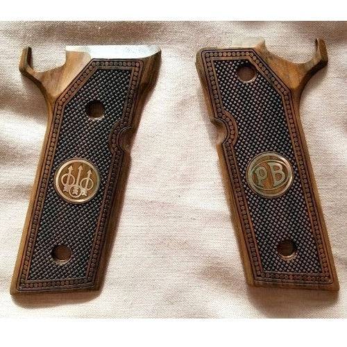 Beretta 92 Steel 1 custom pistol grips made of walnut wood with custom logos made of silver.