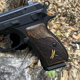 CZ P01 grips made of root walnut wood with waterlines and custom brass logo, designed for CZ 75 compact pistol.