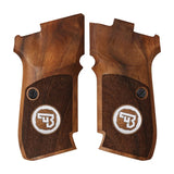 Cz 82 custom pistol grips made of walnut wood with silver custom logo on a firearm.