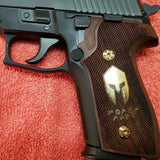 Sig Sauer M11-A1 custom walnut wood grips with brass logo and inlay for enhanced firearm handling and style.