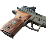 Sig Sauer M11-A1 custom grips made of walnut wood with dragonskin checkering and silver logo inlay.