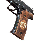 Sig Sauer M11-A1 custom walnut wood grips with silver logo inlay, designed for enhanced grip and aesthetic appeal.