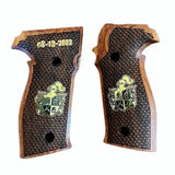Sig Sauer P229 custom walnut wood grips with brass logo and text, designed for improved grip and aesthetic appeal.
