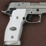 Sig Sauer P226 SAO custom grips made from white PMMA acrylic with silver logo inlay, designed for enhanced grip and style.
