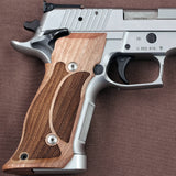 Sig Sauer P226 SAO custom grips made from walnut wood with an integrated magwell, designed for improved handling and style.