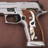 Sig Sauer P226 X5 pistol with custom walnut wood grips featuring silver logo inlay, showcasing detailed firearm grip design.