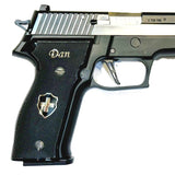 Sig Sauer P229 custom grips made from black PMMA acrylic with silver logo and inlay, designed for Sig Sauer pistols.