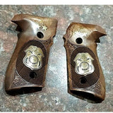 Sig Sauer P226 custom grips made from black PMMA acrylic with silver logo inlay for enhanced firearm handling and style.
