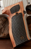 Sig Sauer M11-A1 custom grips made from walnut wood on a pistol, showcasing natural grain and ergonomic design.