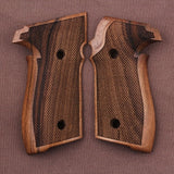 Sig Sauer M11-A1 pistol with custom walnut wood grips from Bestpistolgrips, showing close-up of textured grip surface.