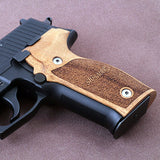 Sig Sauer P226 M11-A1 custom walnut wood grips with engraved Sig Sauer logo for enhanced firearm style and grip.
