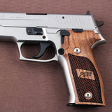 Walnut wood Sig Sauer P226 Legion custom grips with dragon skin checkering and engraved logo, designed for enhanced grip and style.