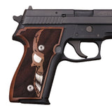 Walnut wood Sig Sauer P226 custom grips with silver skull inlay, designed for ergonomic firearm handling and stylish appearance.