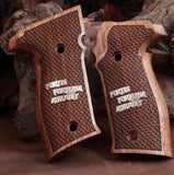 Sig Sauer P228 custom grips made from walnut wood with silver text inlay, designed for the Sig Sauer pistol.