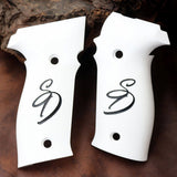 Sig Sauer P226 custom grips made from white PMMA acrylic with engraved logo, designed for improved grip and style.