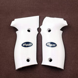 Sig Sauer P226 M11-A1 custom grips made from white PMMA acrylic with silver Sig Sauer logo, designed for enhanced firearm handling.