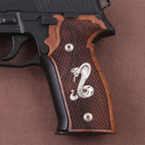 Sig Sauer M11-A1 custom walnut wood grips with silver logo for Sig Sauer P226 pistol, showing detailed wood grain and engraved logo.