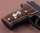 Sig Sauer P228 custom grips made of walnut wood with silver logo, designed for a secure and stylish fit on the pistol.