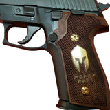 Walnut wood Sig Sauer P228 custom grips with brass logo and inlay, designed for improved grip and aesthetic appeal.