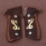Sig Sauer P228 custom grips made from walnut wood with brass logo inlay, designed to enhance firearm appearance and grip.
