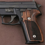 Sig Sauer P228 custom grips made from walnut wood with dragonskin checkering, designed for improved grip and style.