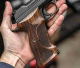 Sig Sauer P229 custom walnut grips with engraved text, designed for professional target shooting.