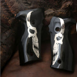 Sig Sauer P229 custom grips made from black PMMA acrylic with silver skull inlay, designed for enhanced firearm handling.