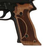 Sig Sauer P229 custom walnut wood grips with professional target design, enhancing firearm grip and aesthetics.