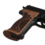 Walnut wood Sig Sauer P229 custom grips with professional target design for enhanced firearm handling and aesthetic appeal.