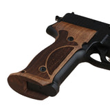Sig Sauer P229 custom grips made from walnut wood with professional target design for enhanced firearm handling and aesthetic appeal.