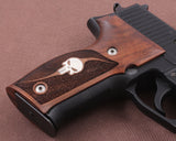 Sig Sauer P229 custom walnut wood grips with silver logo inlay, designed for enhanced grip and classic appearance.