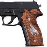 Walnut wood Sig Sauer P228 custom grips with silver logo, designed for ergonomic handling and stylish firearm enhancement.