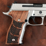 Sig Sauer P229 handgun with custom walnut wood grips by Bestpistolgrips, showing detailed textured finish on the grips