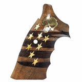 A wooden pistol grip featuring a dark wood striped pattern, gold-colored inlays of stars and a skull, and a central hole, shown against a plain white background.