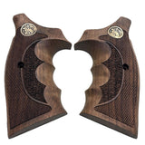 A pair of dark brown wooden pistol grips with textured checkered patterns, featuring a gold-toned circular emblem near the top and a central recessed grip panel.