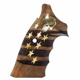 A wooden pistol grip featuring an American flag design with gold-colored stars and a gold skull inlay, set against a plain white background.