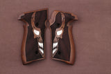 Sig Sauer P226 custom grips with walnut wood texture, designed for enhanced handling and aesthetic appeal on the pistol.